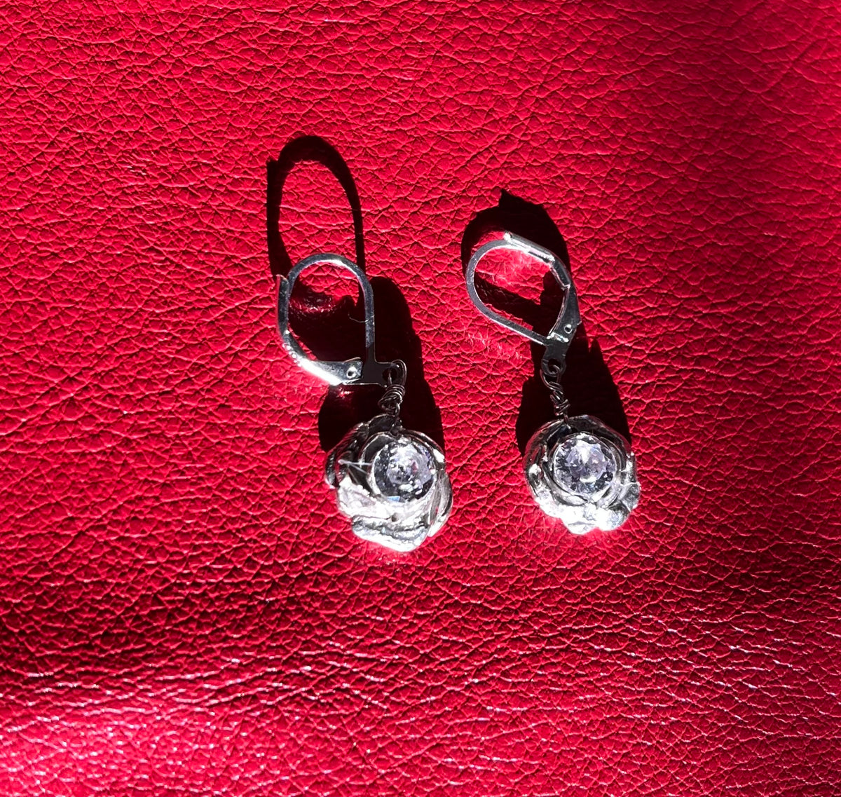 Silver rose and diamond earrings
